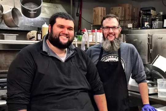 Slap's BBQ pitmasters in the restaurant kitchen